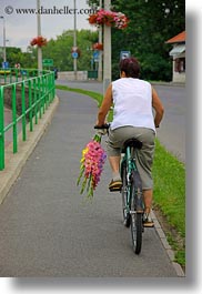 bicycles, bikes, europe, flowers, hungary, riding, tarcal, vertical, womens, photograph