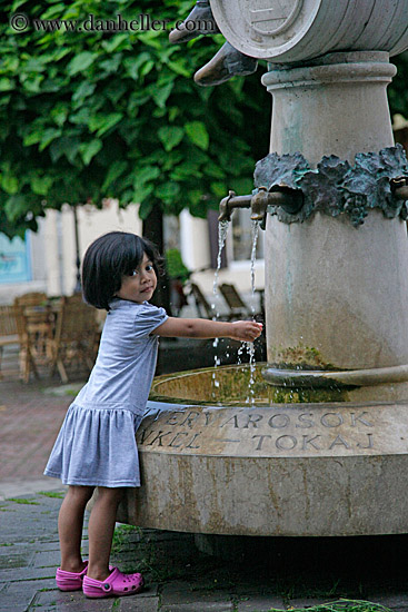 little-girl-washing-hands-in-fountain-water-2.jpg
