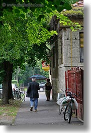 images/Europe/Hungary/TokajHills/Misc/man-w-umbrella-walking-under-trees.jpg