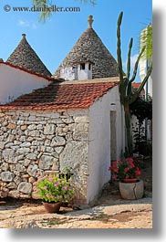 alberobello, buildings, europe, farm house, flowers, italy, puglia, structures, trullis, vertical, photograph