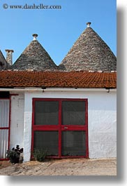 alberobello, buildings, doors, europe, farm house, italy, puglia, red, screen, structures, trullis, vertical, photograph