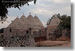 alberobello, buildings, europe, farm house, fences, horizontal, italy, puglia, stones, structures, trullis, photograph