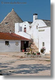 alberobello, buildings, europe, farm house, houses, italy, puglia, structures, trullis, vertical, wash, white, photograph