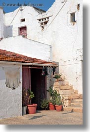 alberobello, buildings, europe, farm house, houses, italy, puglia, vertical, wash, white, photograph