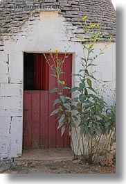 alberobello, buildings, doors, europe, flowers, italy, puglia, trullis, vertical, photograph