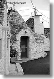alberobello, black and white, buildings, europe, italy, puglia, structures, trullis, vertical, wash, white, photograph
