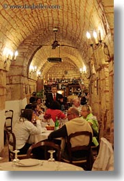 alberobello, archways, eating, europe, italy, people, puglia, restaurants, structures, vertical, photograph