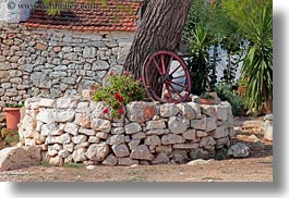 alberobello, europe, flowers, horizontal, italy, plants, puglia, trees, wagons, wheels, photograph