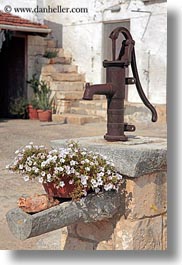 alberobello, europe, flowers, italy, materials, metal, plants, puglia, pumps, rust, vertical, water, photograph