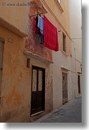 europe, gallipoli, italy, laundry, puglia, red, vertical, photograph