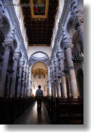 aisle, basilica di croce, europe, glow, italy, lecce, lights, men, puglia, silhouettes, vertical, photograph