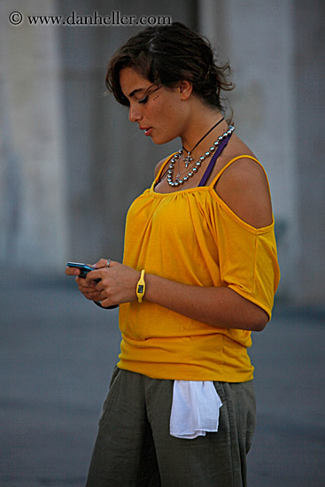woman-in-yellow-w-cell-phone.jpg
