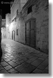 black and white, cobblestones, europe, glow, italy, lights, long exposure, matera, narrow, nite, puglia, streets, towns, vertical, photograph