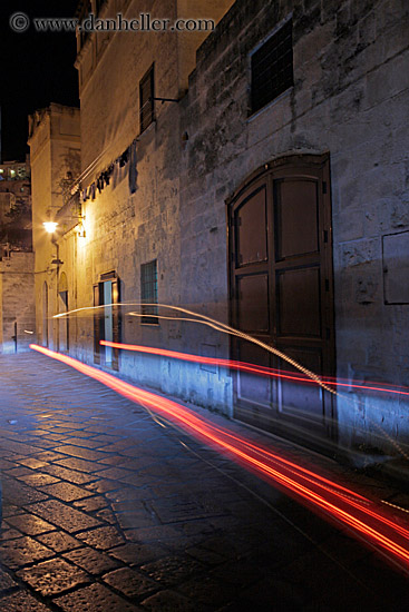 cobblestone-narrow-street-w-car-light-streaks.jpg
