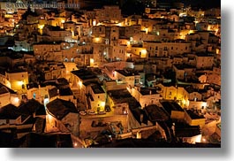 buildings, cityscapes, europe, glow, hills, homes, horizontal, italy, lights, matera, nite, puglia, stones, structures, towns, photograph