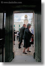 churches, doors, europe, italy, noci, people, puglia, vertical, photograph