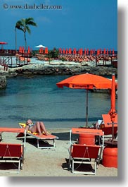 beaches, chairs, europe, italy, oranges, puglia, seaside, sunbathing, vertical, womens, photograph