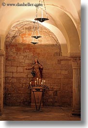 arches, buildings, candles, churches, europe, italy, madonna, puglia, statues, trani, under, vertical, photograph