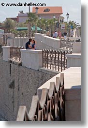 couples, europe, italy, people, puglia, seaside, teenage, trani, vertical, walls, photograph