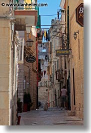 dogs, europe, italy, men, narrow, puglia, streets, trani, vertical, walking, photograph