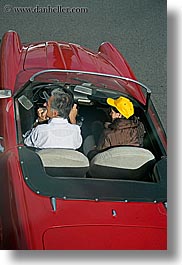 baseball cap, cars, clothes, colors, couples, downview, europe, hats, italy, people, perspective, red, rome, vertical, yellow, photograph