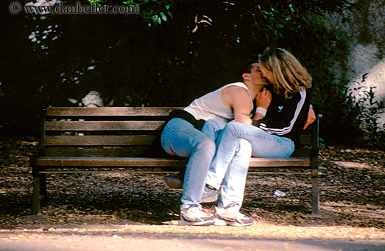 couple-kissing-on-bench.jpg