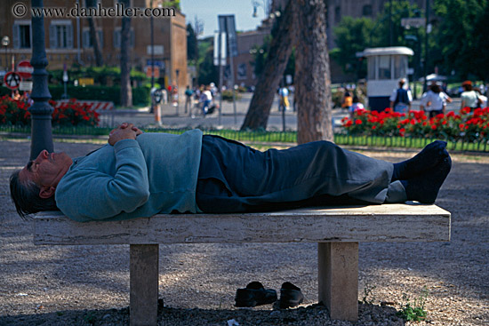 man-lying-on-stone-bench-2.jpg