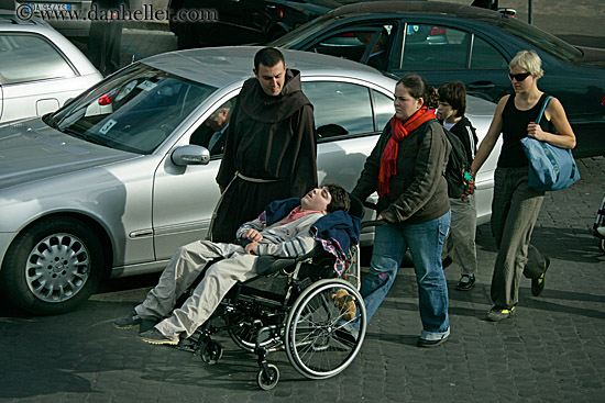 monk-w-boy-in-wheel-chair.jpg