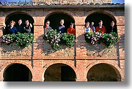 archways, bricks, europe, flowers, groups, happy, horizontal, italy, people, tourists, tuscany, photograph