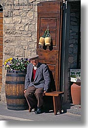 barrels, europe, flowers, italy, men, old, senior citizen, stones, tuscany, vertical, photograph