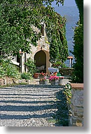 archways, country, covered, europe, fattoria lavacchio, flowers, houses, italy, ivy, stones, towns, tuscany, vertical, photograph