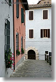 cobblestones, europe, flowers, italy, montalcino, towns, tuscany, vertical, windows, photograph