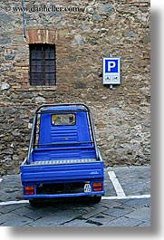 cobblestones, europe, italy, montalcino, parking, signs, small, streets, towns, trucks, tuscany, vertical, windows, photograph
