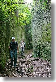 architectural ruins, cuts, etruscan, etruscan cuts, europe, hikers, hiking, italy, people, pitigliano, towns, tuscany, vertical, photograph