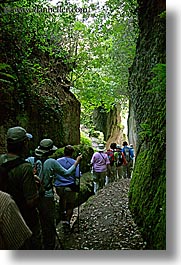 architectural ruins, cuts, etruscan, etruscan cuts, europe, hikers, hiking, italy, people, pitigliano, towns, tuscany, vertical, photograph