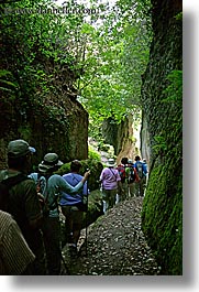 architectural ruins, cuts, etruscan, etruscan cuts, europe, hikers, hiking, italy, people, pitigliano, towns, tuscany, vertical, photograph