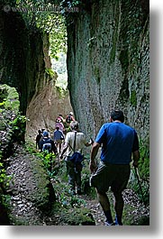 architectural ruins, cuts, etruscan, etruscan cuts, europe, hikers, hiking, italy, people, pitigliano, towns, tuscany, vertical, photograph