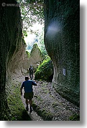 architectural ruins, cuts, etruscan, etruscan cuts, europe, hikers, hiking, italy, people, pitigliano, towns, tuscany, vertical, photograph