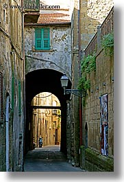 alleys, arches, archways, cobblestones, europe, italy, motorcycles, narrow streets, pitigliano, streets, towns, tuscany, vertical, windows, photograph