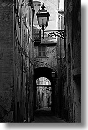 alleys, archways, black and white, cobblestones, europe, italy, lamp posts, narrow streets, pitigliano, streets, towns, tuscany, vertical, photograph