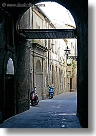 alleys, archways, cobblestones, europe, italy, motorcycles, narrow streets, pitigliano, streets, towns, tuscany, vertical, photograph