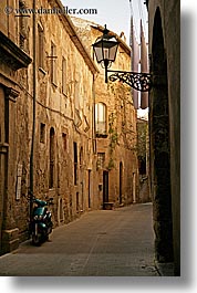 alleys, cobblestones, europe, italy, lamp posts, motorcycles, narrow streets, pitigliano, streets, towns, tuscany, vertical, photograph