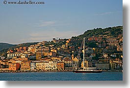 boats, europe, horizontal, italy, passing, porto ercole, towns, tuscany, photograph