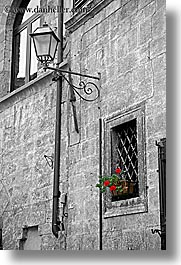 black and white, europe, flowers, geraniums, italy, lamp posts, san quirico, stones, towns, tuscany, vertical, windows, photograph