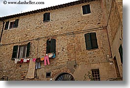 bricks, europe, hangings, horizontal, italy, laundry, san quirico, stones, towns, tuscany, photograph