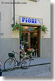 bicycles, europe, flowers, italy, scarperia, shops, towns, tuscany, vertical, photograph