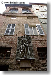 bricks, bronze, europe, italy, sculptures, siena, statues, towns, tuscany, vertical, walls, photograph