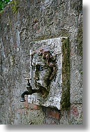 europe, faces, italy, siena, spogot, stones, towns, tuscany, vertical, water, photograph