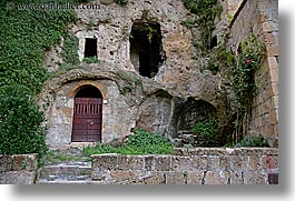 archways, doors, europe, horizontal, italy, rocks, sorano, towns, tuscany, walls, photograph
