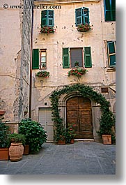 archways, doors, europe, italy, plants, sorano, towns, tuscany, vertical, windows, photograph